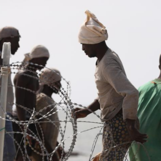 File Photo: African migrants are seen at the Libya-Tunisia border in Ras Ajdir, Libya, on July 26, 2023. /Xinhua