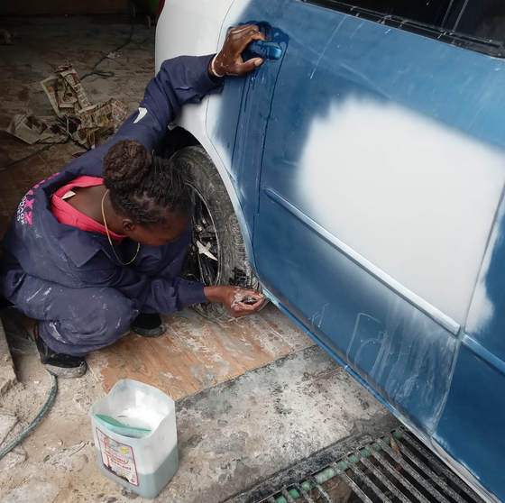 Female mechanic works on a vehicle at Chixz Auto Garage & Services. (Image: Supplied)